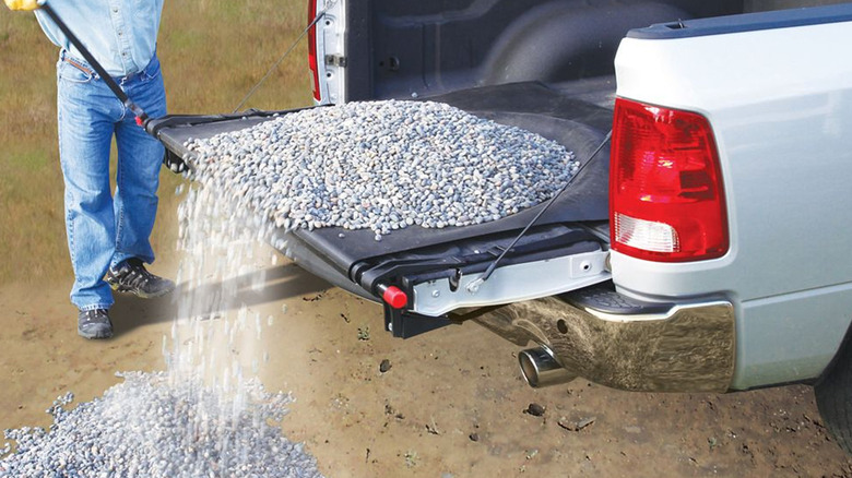 person unloading gravel