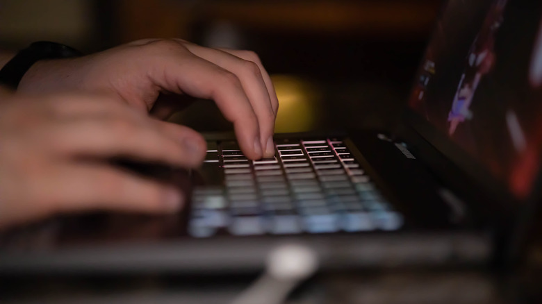 Person gaming on Acer laptop