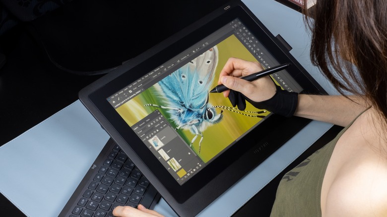 Artist uses drawing tablet