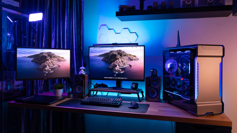 Full PC gaming setup with two monitors and peripherals 