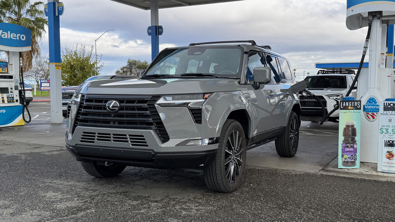 Gray Lexus GX filling up at a gas station