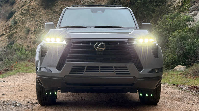 Head-on view of a Lexus GX with lights on