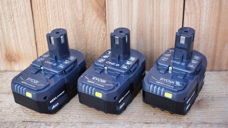 Three Ryobi tool batteries