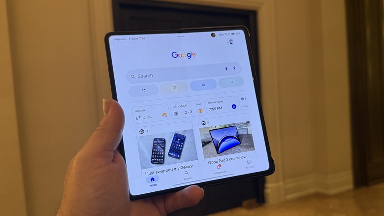 man holding an Honor Magic V5