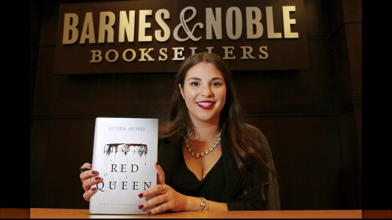 Victoria Aveyard smiling with book