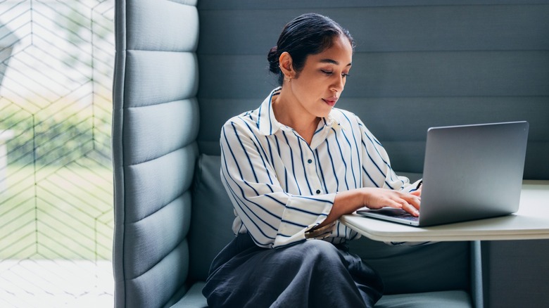 Woman using a laptop on a table