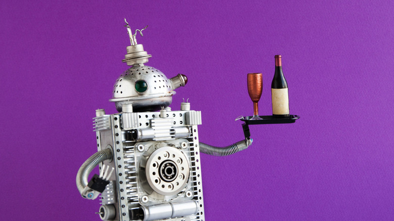 A robot carrying wine.