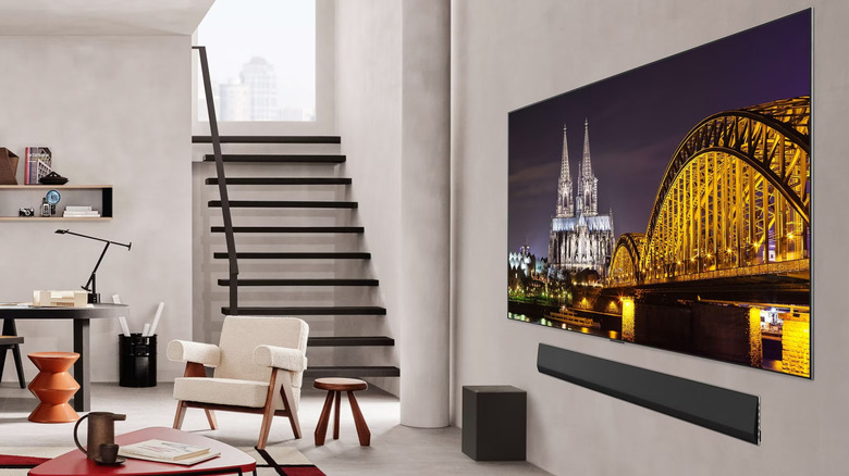 An LG AI TV mounted on the wall