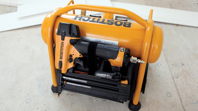 Bostitch air compressor with tools in pocket