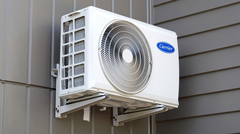 An outdoor Carrier air-conditioning attached to a building.