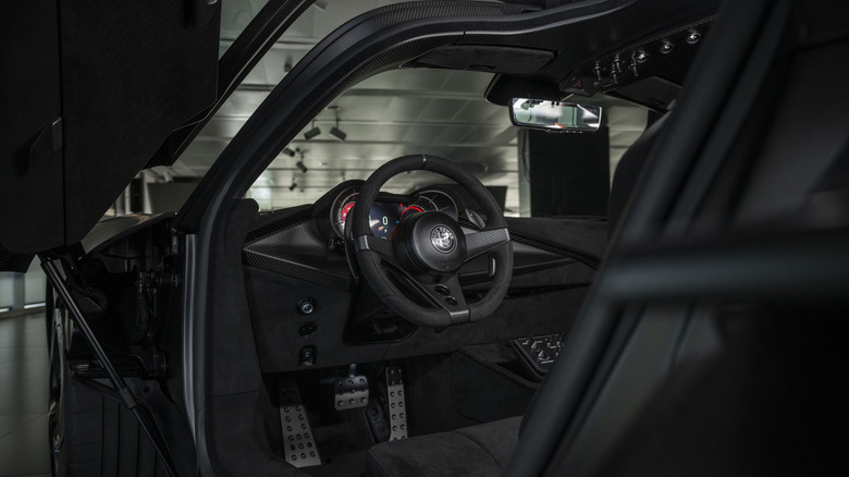 Close shot of driver's cockpit of Alfa Romeo 33 Stradale Perla Nero with door open