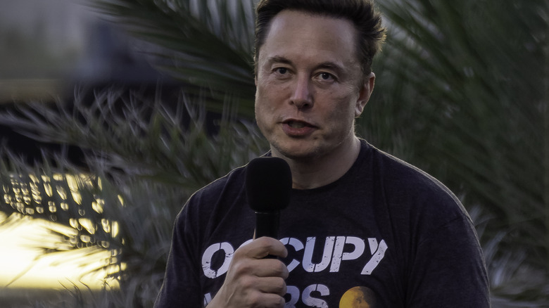 Elon Musk speaking at an event 