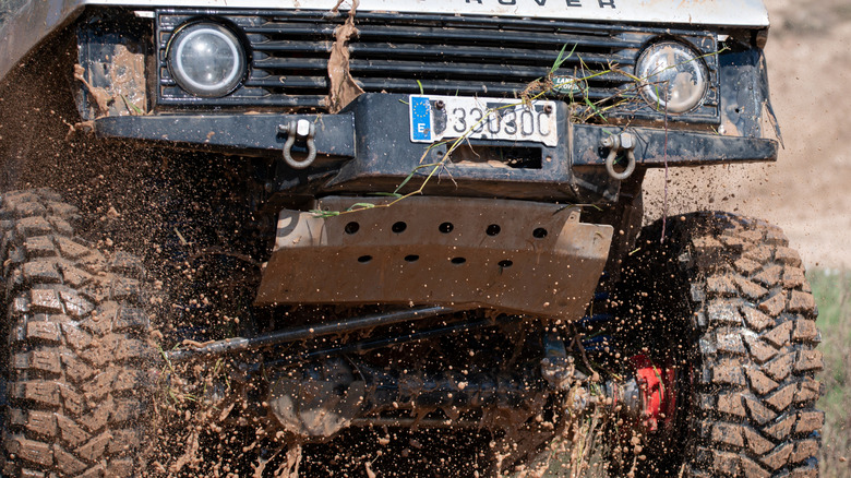 A Land Rover SUV with a visible skid plate