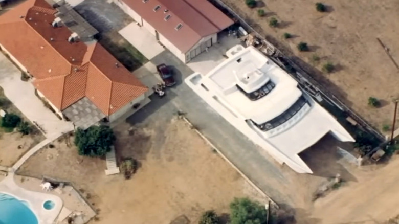 Overhead view of homemade yacht in driveway