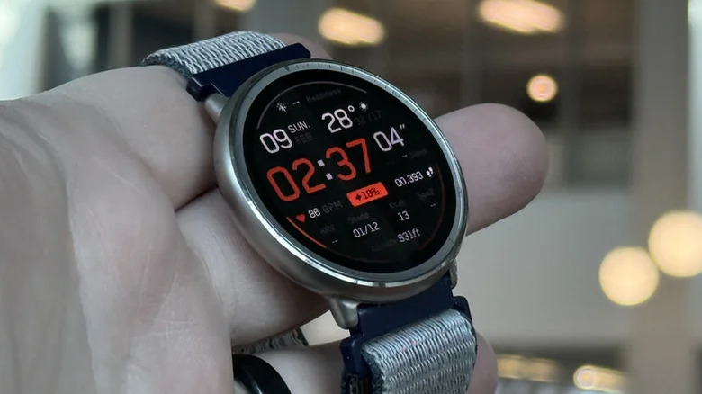 Hand holding a Amazfit Active 2 smartwatch