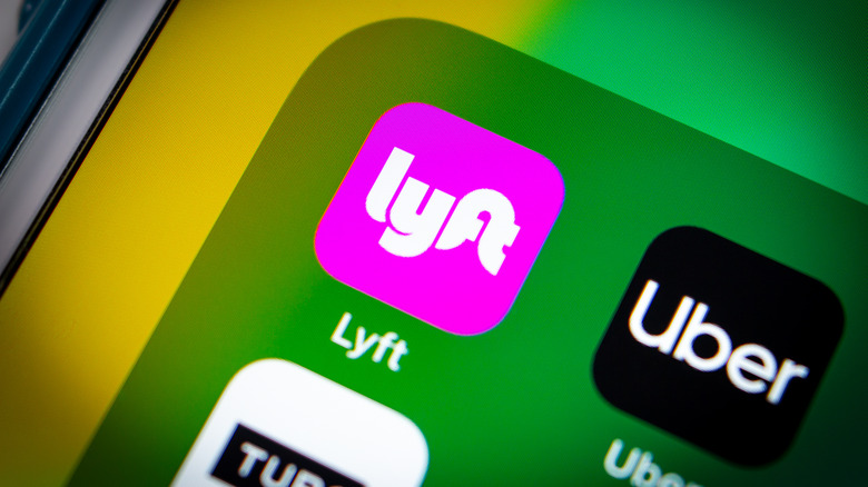 Lyft and Uber logos on screen