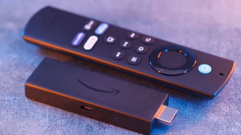 An Amazon Fire Stick and remote on a table