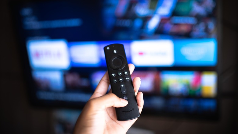 Person holding an Amazon Fire TV remote