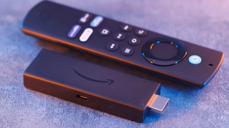 Fire TV Stick next to its remote