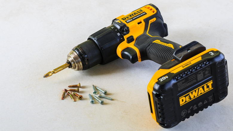 Dewalt drill on its side on a white surface