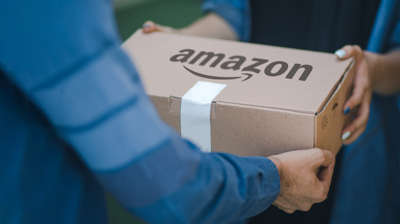 Someone handing amazon package