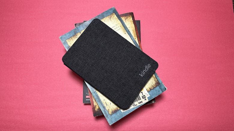 Kindle on a stack of books