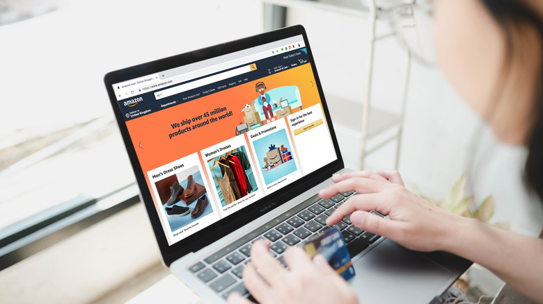 Person browsing Amazon on a laptop
