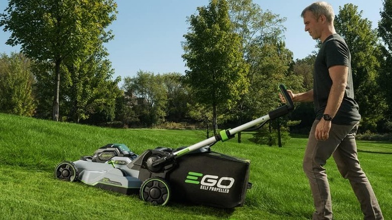 Man mowing lawn with Ego Power+ Self-Propelled Electric Lawn Mower