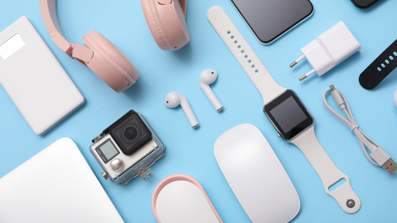 Various electronic gadgets laid on a flat table