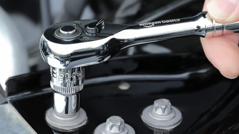 An Amazon Basics socket set used to work on a car.