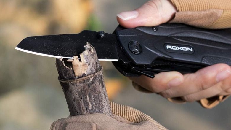 The Roxon CM1349 Spark Multi Tool used to cut wood.