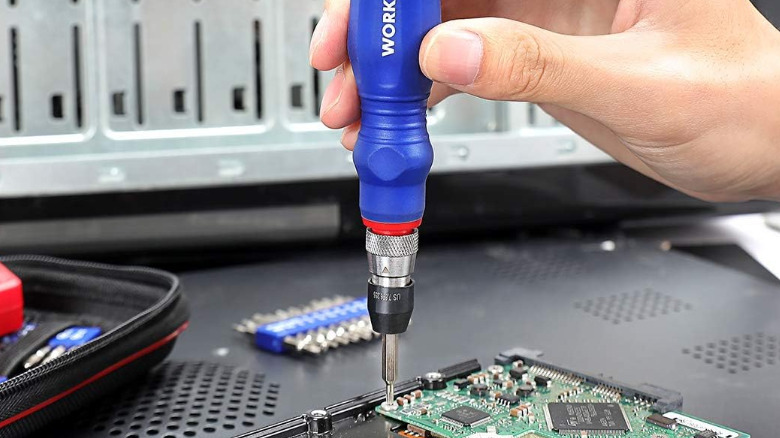 WorkPro Precision Screwdriver used to disassemble a laptop.