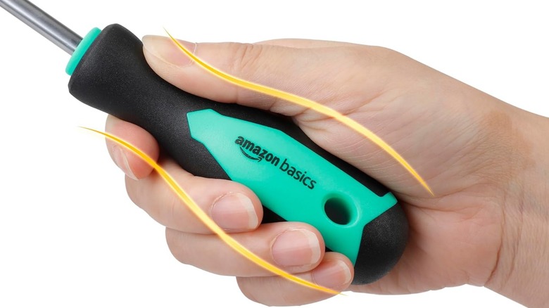 a person holding an amazon basics screwdriver