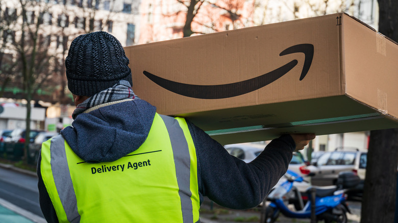 Amazon employee carrying package