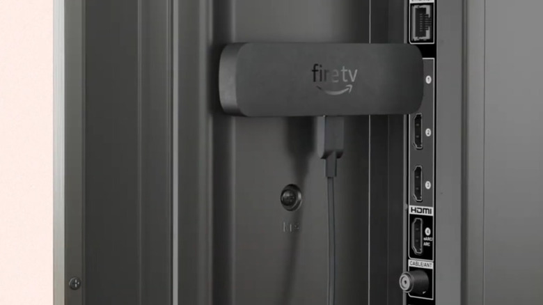 Amazon Fire TV Stick 4K Select plugged into back of television