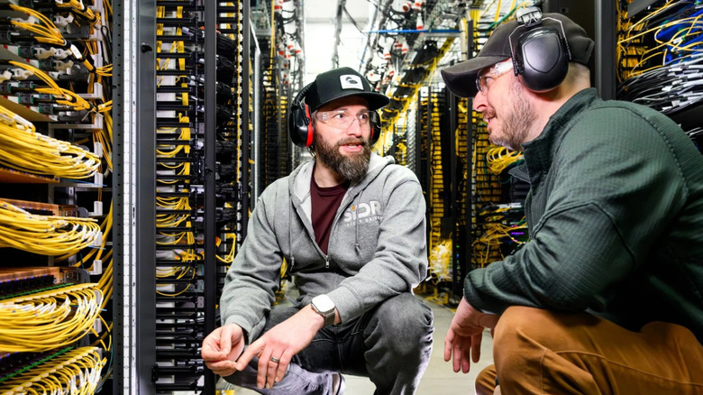 AWS VP of Network Engineering Matt Rehder (left) working with his team in a AWS data center