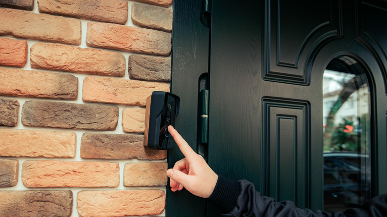 Person ringing Ring doorbell