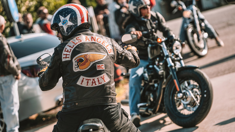 A Hells Angel Biker from the Italy chapter moving down a side street