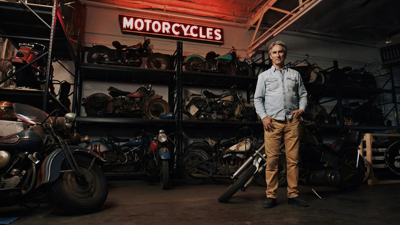 Mike Wolfe with motorcycle collection at auction