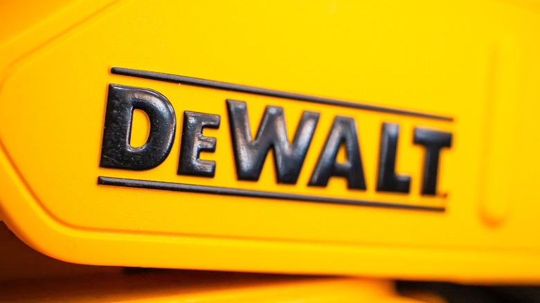 The DeWalt logo on the side of a charger.