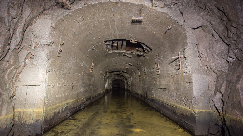 Inside a partially flooded mine tunnel