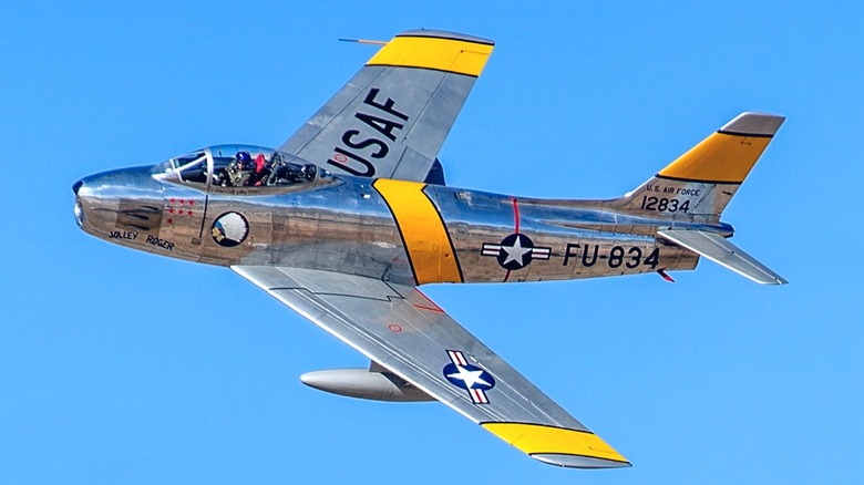 An F-86 Sabre flying over blue skies