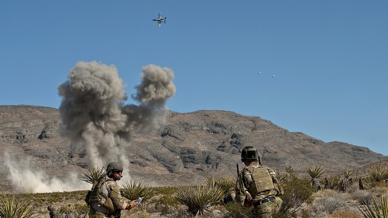 Soldiers at a JTAC simulation training at Nevada TTR, an A-10 Warthog in the distance