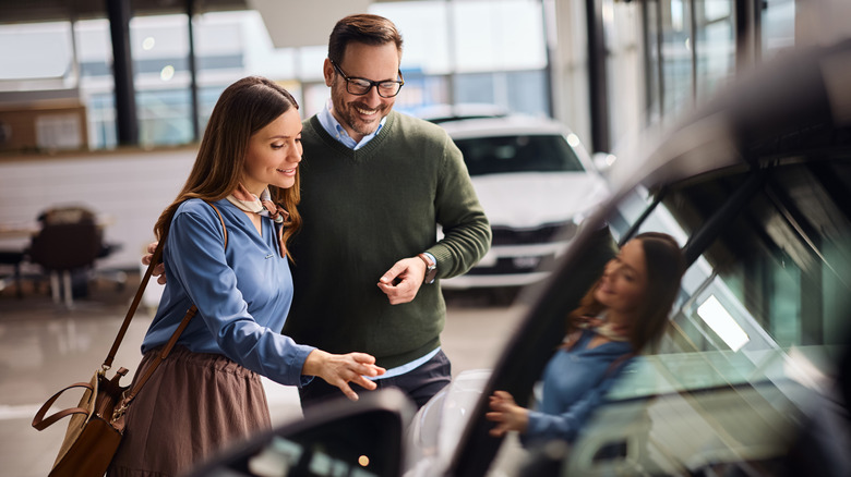 Couple shopping for new car