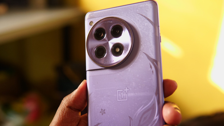 Person holding a purple OnePlus smartphone