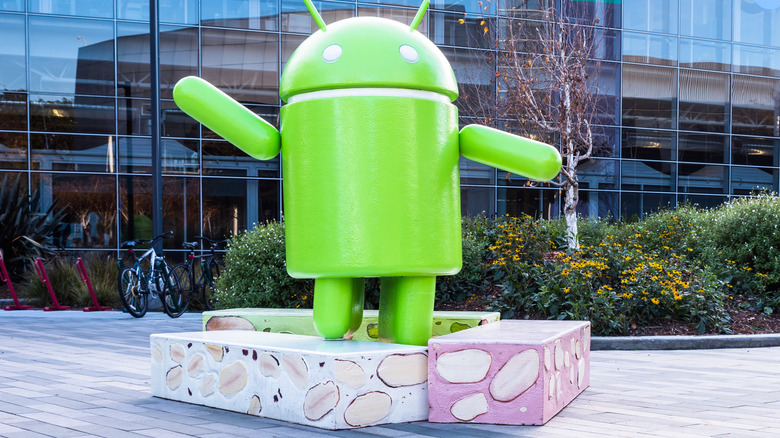 A large Android figure in front of Google's headquarters