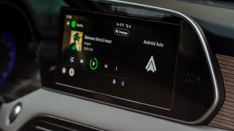 Close-up of Android Auto playing music on a car infotainment display