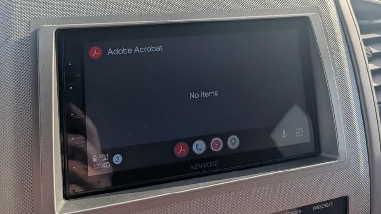 Car dashboard with Adobe Acrobat on the infotainment screen