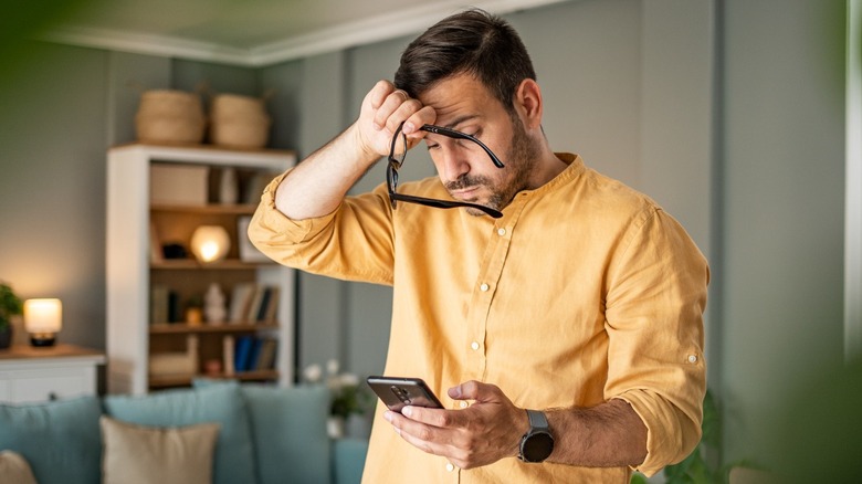 Person frustrated at phone