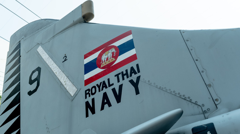 Royal Thai Navy text on aircraft vertical stabilizer